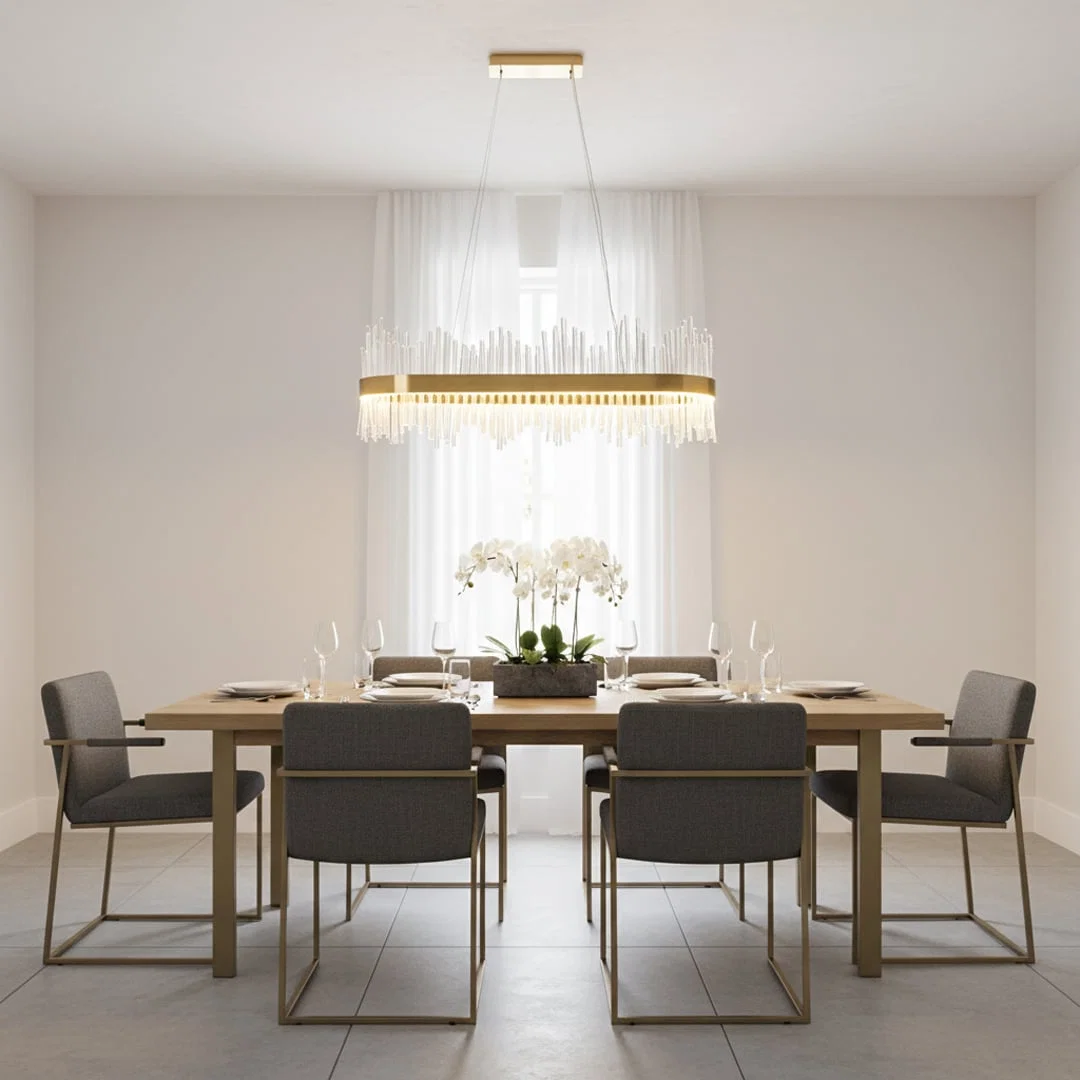 Gold metal chandelier with clear glass rods glowing warmly above a modern dining table creating an elegant bright and luxurious interior atmosphere.