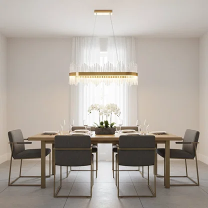 Gold metal chandelier with clear glass rods glowing warmly above a modern dining table creating an elegant bright and luxurious interior atmosphere.