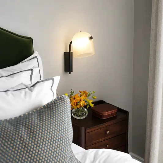 Lifestyle image of white mona wall light for elegant living room decor styling and modern home lighting.