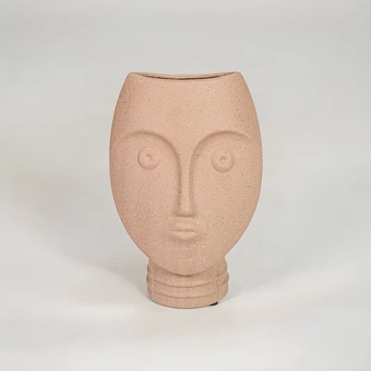 Pink textured face ceramic vase for stylish console table placement and contemporary indoor decor styling.