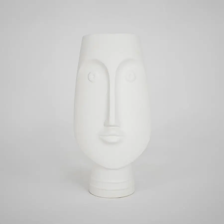 White face ceramic vase for elegant console table placement and contemporary indoor home decor styling piece.