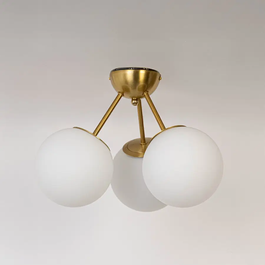 Gold ceiling light with frosted glass globes and metal frame in off mode displayed on white background for ceiling lighting.