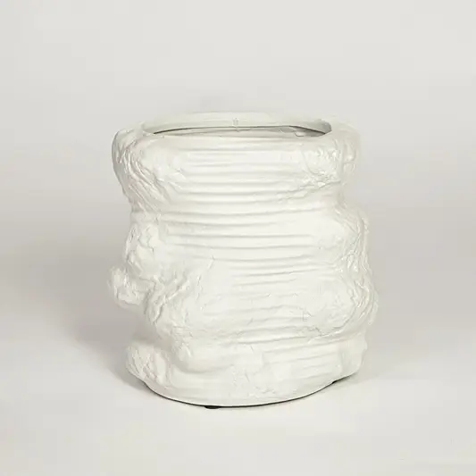 White ceramic planter on white background textured modern decorative plant pot for living room floor styling home.