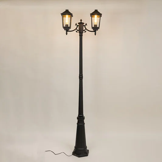 Decorative black outdoor street lamp with warm glowing lanterns for luxury exterior decor use.