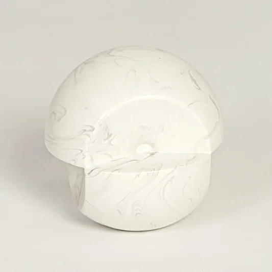 Modern white marble look ceramic statement decor piece with organic rounded silhouette for contemporary interiors.