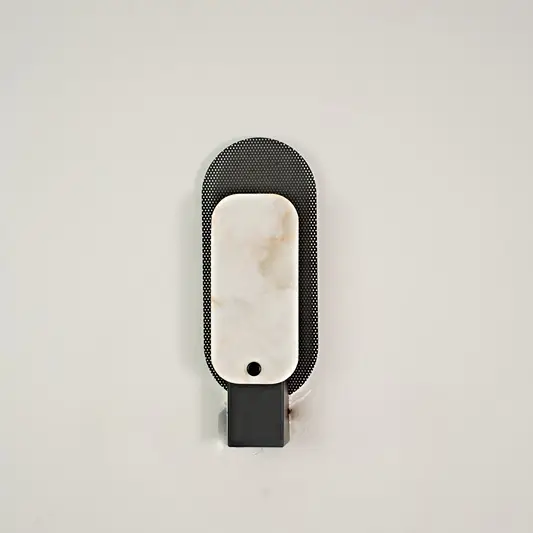 Obsidian Alabaster Wall Sconce switched off on white background.