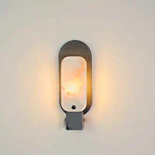 Obsidian Alabaster Wall Sconce illuminated on white background.