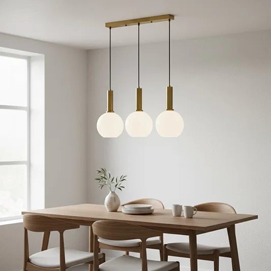 White glass pendant lights creating elegant ambience above the dining table in modern interiors.