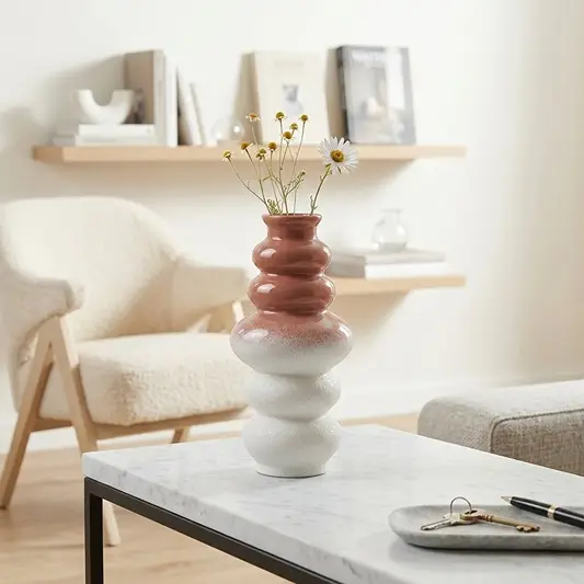 Multicolor ceramic flower vase set styled on coffee table for elegant modern home decor placement ideas.