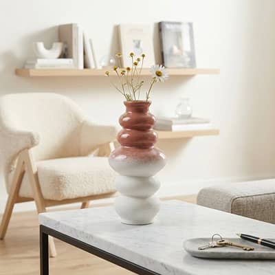 Multicolor ceramic flower vase set styled on coffee table for elegant modern home decor placement ideas.