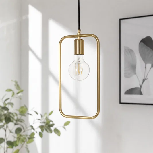 Amber glass and gold metal pendant light with open frame adding elegance to bright interiors.