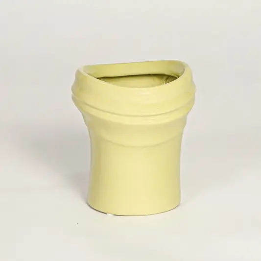Minimal yellow ceramic decor vase with rounded shape and polished surface designed for tabletop floral arrangements.