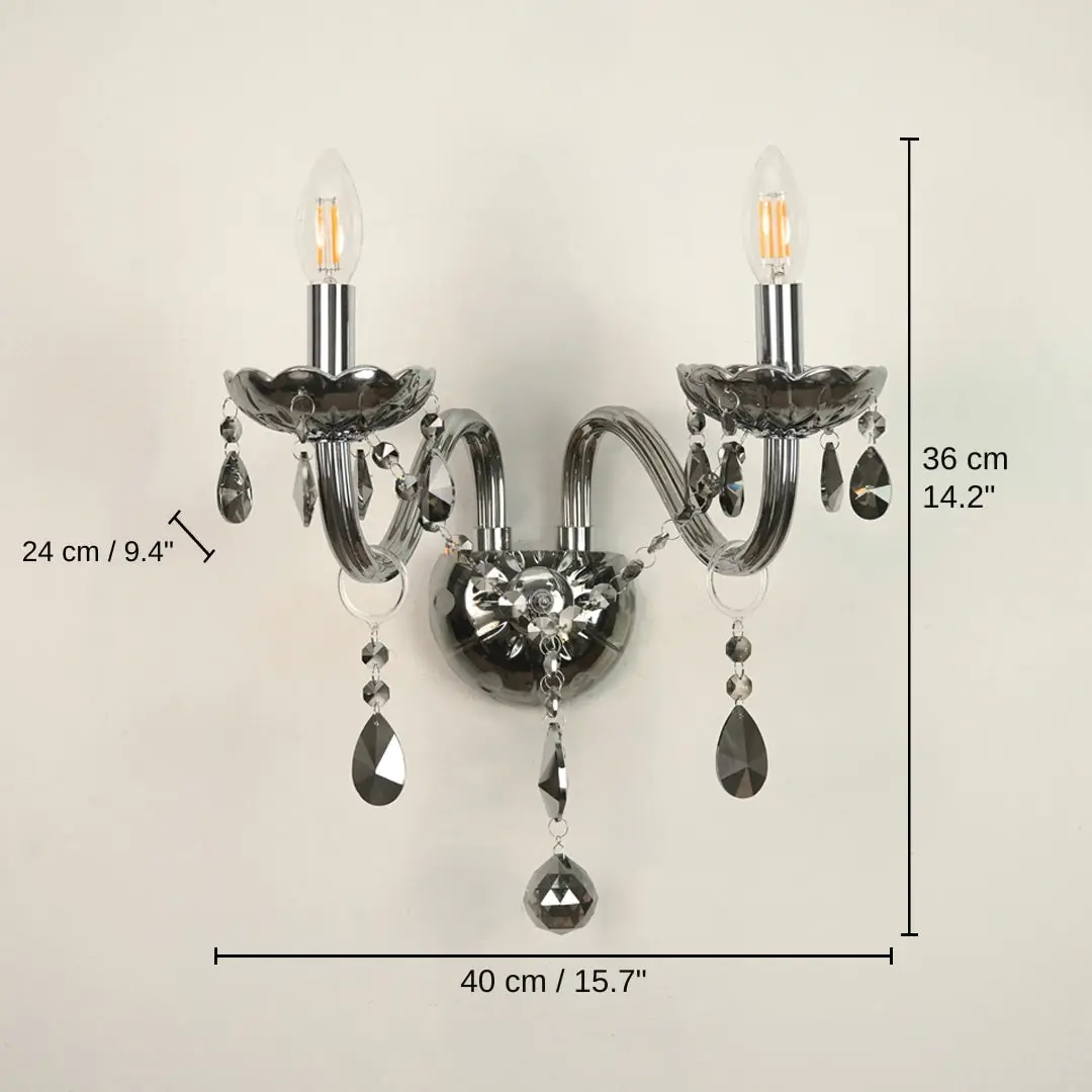 Wall-mounted two-light sconce with dark smoked glass cups, clear teardrop crystal drops, and visible bulb filaments, 36 x 40 x 24 cm (14.2 x 15.7 x 9.4 inches) dimensions