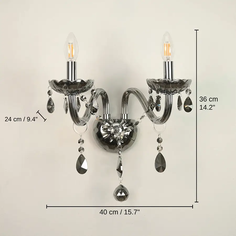 Wall-mounted two-light sconce with dark smoked glass cups, clear teardrop crystal drops, and visible bulb filaments, 36 x 40 x 24 cm (14.2 x 15.7 x 9.4 inches) dimensions