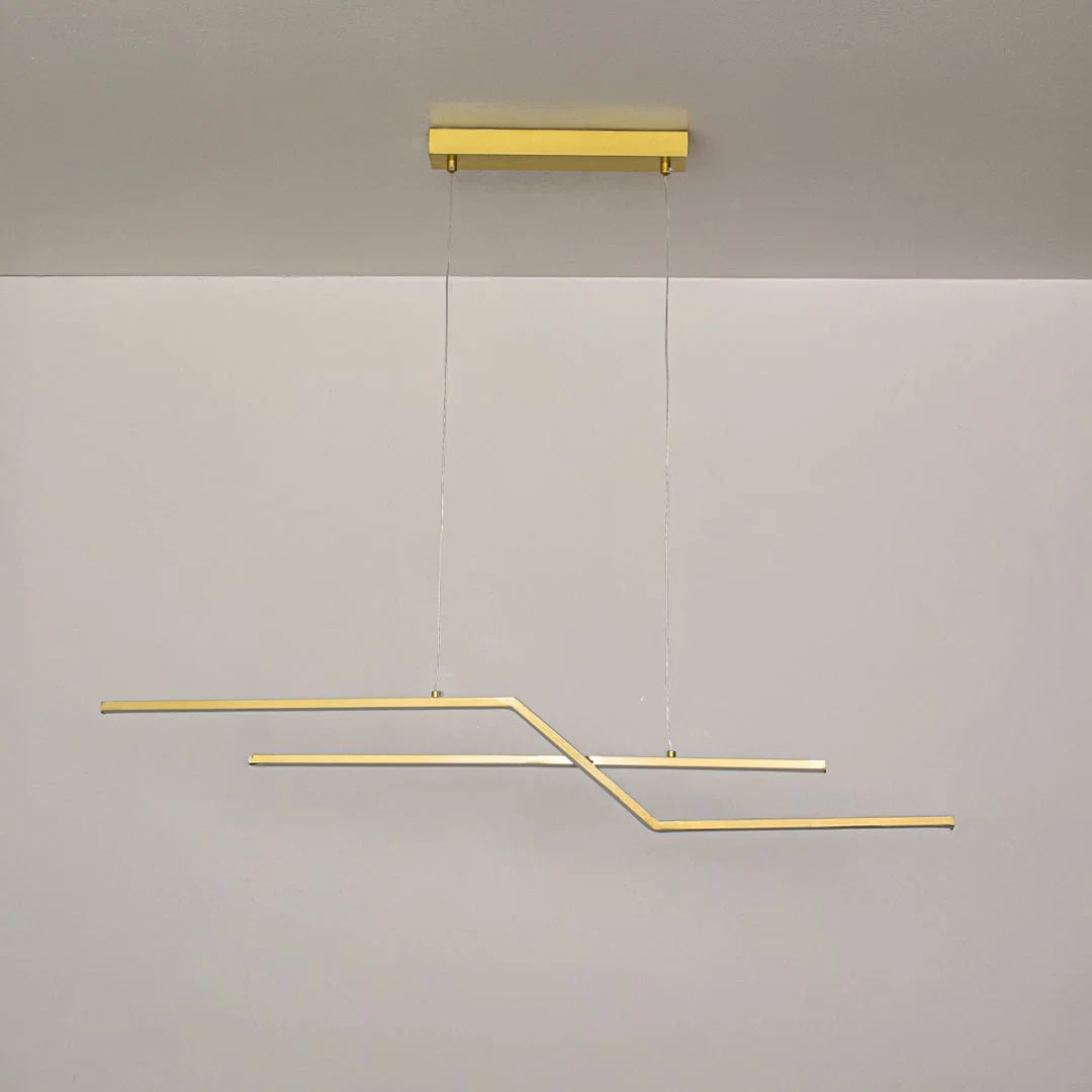 Gold metal linear pendant light switched off on white background highlighting minimalist form for modern ceiling decor.