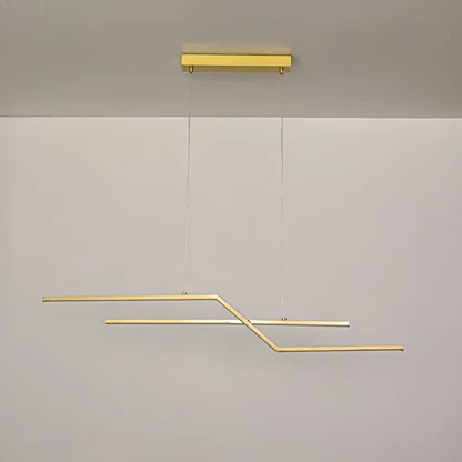 Gold metal linear pendant light switched off on white background highlighting minimalist form for modern ceiling decor.