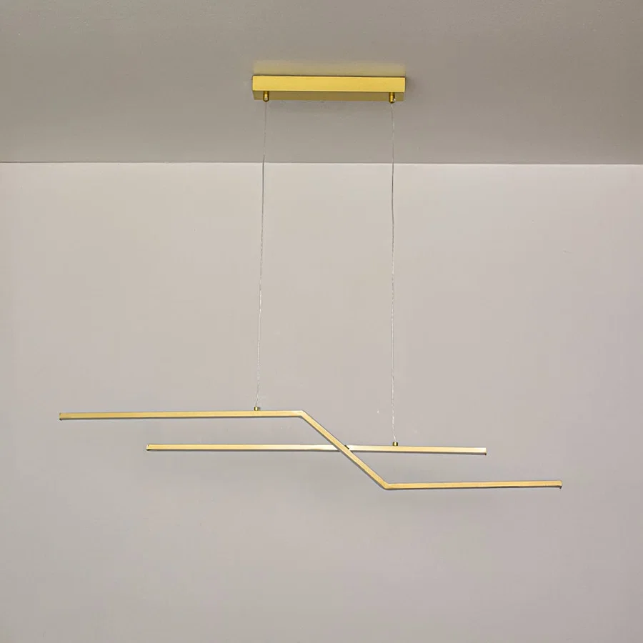 Gold metal linear pendant light switched off on white background highlighting minimalist form for modern ceiling decor.