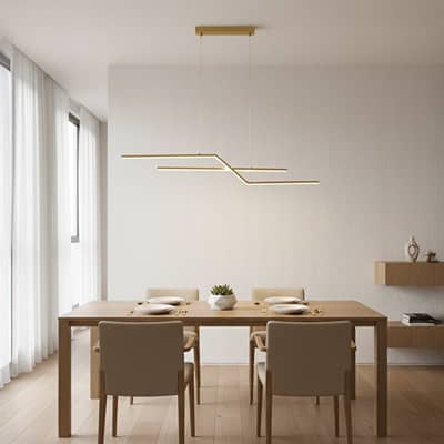 Gold metal linear pendant light styled above dining area creating sleek modern ceiling lighting for contemporary home interiors.