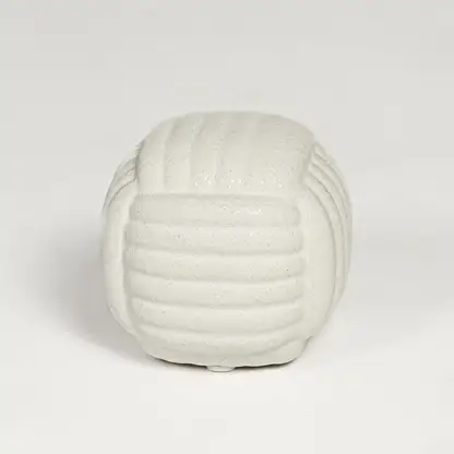 White ceramic textured decorative jar with rounded sculpted design isolated on clean white background for elegant tabletop display.