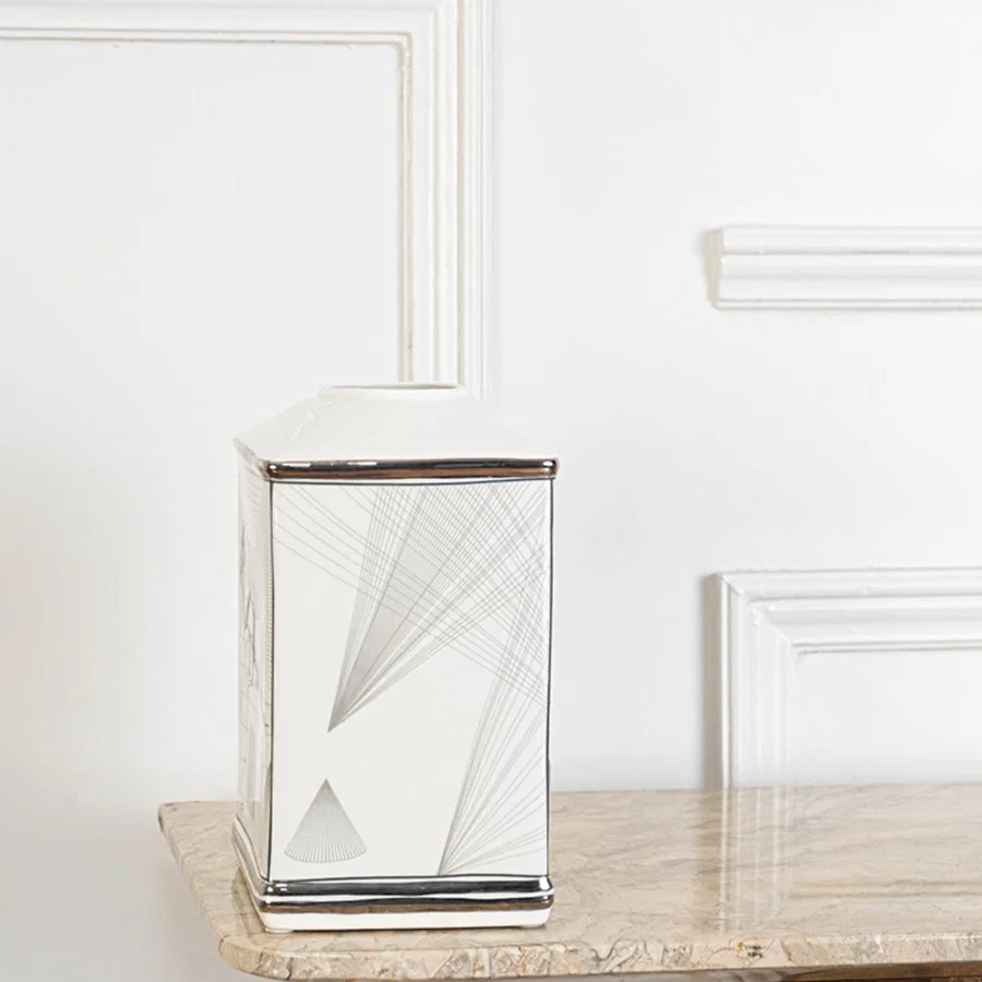 White ceramic jar with silver geometric line detailing perfect for modern home décor and clean minimalist styling.
