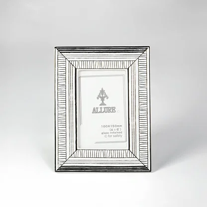 Silver textured photo frame for elegant tabletop placement and contemporary indoor home decor styling accent piece.
