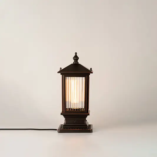 Black outdoor gate light with warm glowing bulb for elegant modern exterior decor styling use.