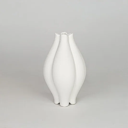 Modern white decorative flower vase isolated clean background stylish ceramic vase for home decor accent.