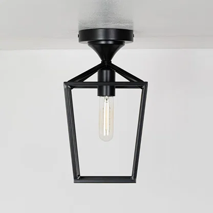 Outdoor black metal ceiling lantern with clear inner glass shown with lights off on a white background emphasizing its open frame design.