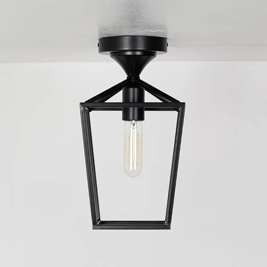 Outdoor black metal ceiling lantern with clear inner glass shown with lights off on a white background emphasizing its open frame design.