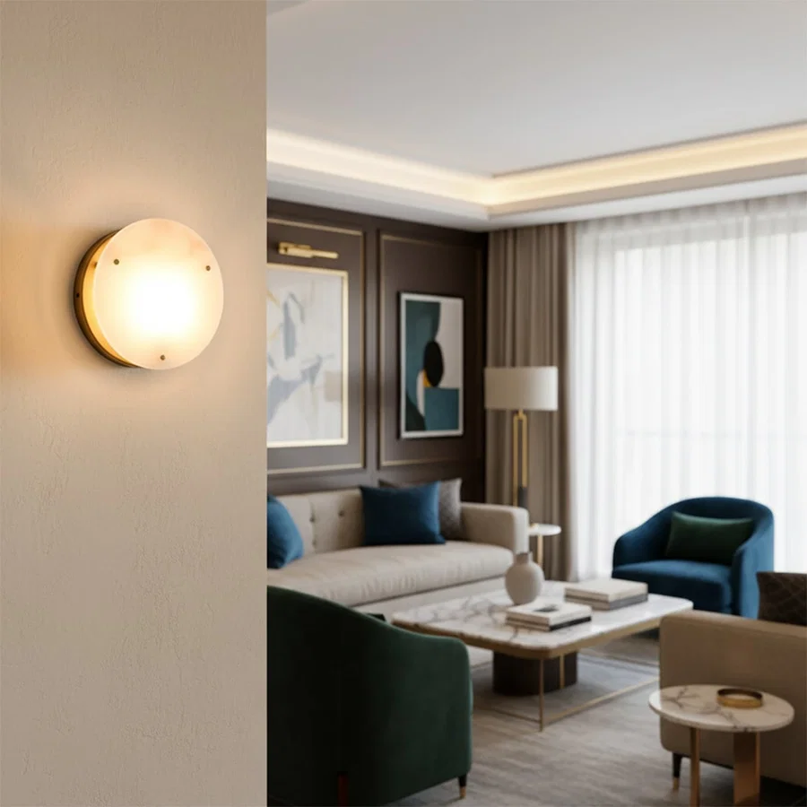 Wall mounted round light in warm glow placed in living room adding soft illumination and modern accent to elegant interior decor.