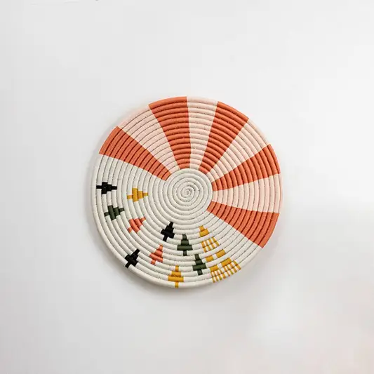 Round handcrafted multicolor seagrass wall basket for living room hallway and boho décor on white background image.