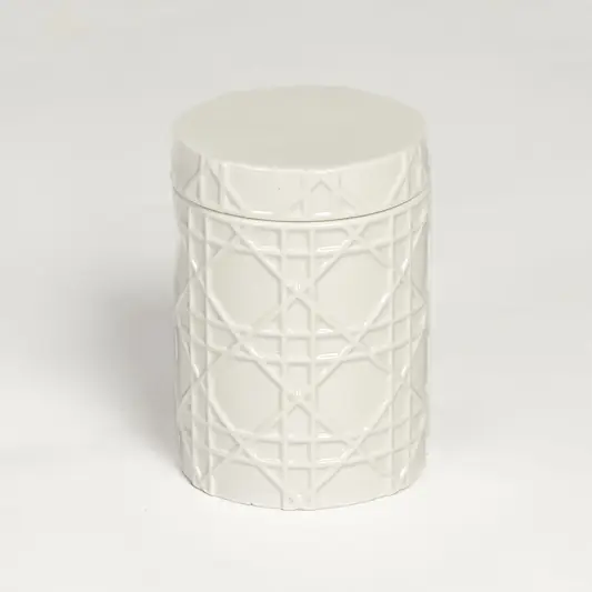 White ceramic decorative jar with embossed geometric pattern isolated on clean white background for elegant tabletop decor display.