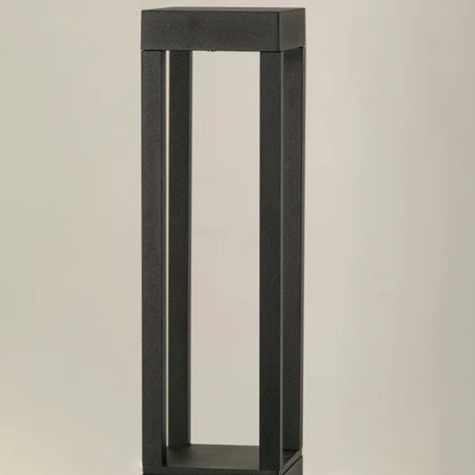 Closeup of black metal outdoor bollard light frame for modern exterior decor styling use.