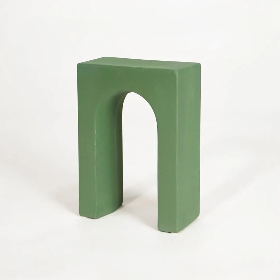 Minimal green wooden decorative stand for tabletop shelf console and modern home decor on white background image.