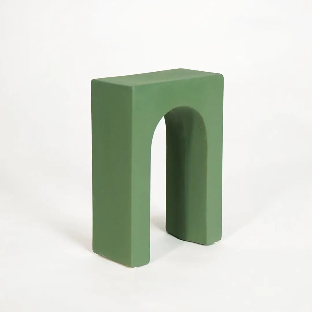 Green wooden decorative display stand for shelf console table and modern home decor on white background image.