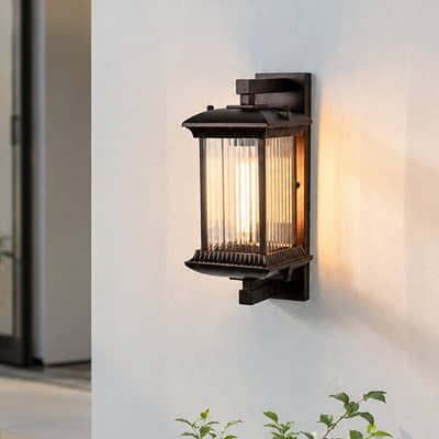 Vintage black metal outdoor hanging lantern for porch entrance balcony and covered patio with warm ambient lighting.