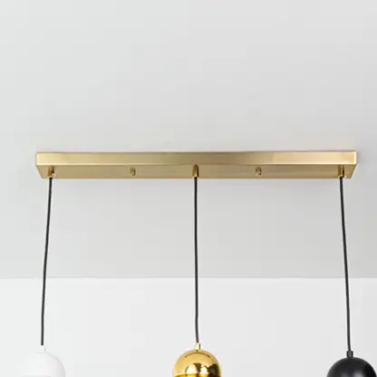 Gold metal linear canopy with suspended cords highlighting sleek modern craftsmanship and finish.