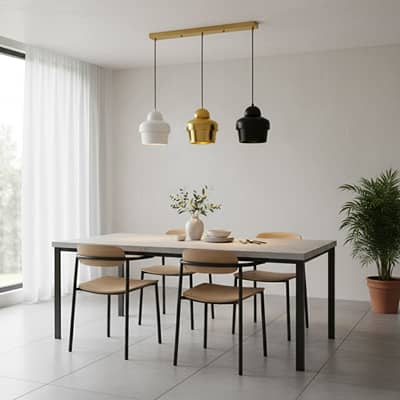 Mixed finish pendant lights creating warm ambience above the dining table in contemporary spaces.