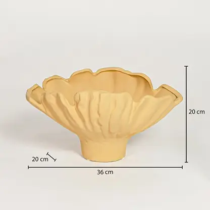Yellow ceramic ruffled decorative bowl measuring 20 cm height 36 cm width and 20 cm depth perfect for statement table decor placement.