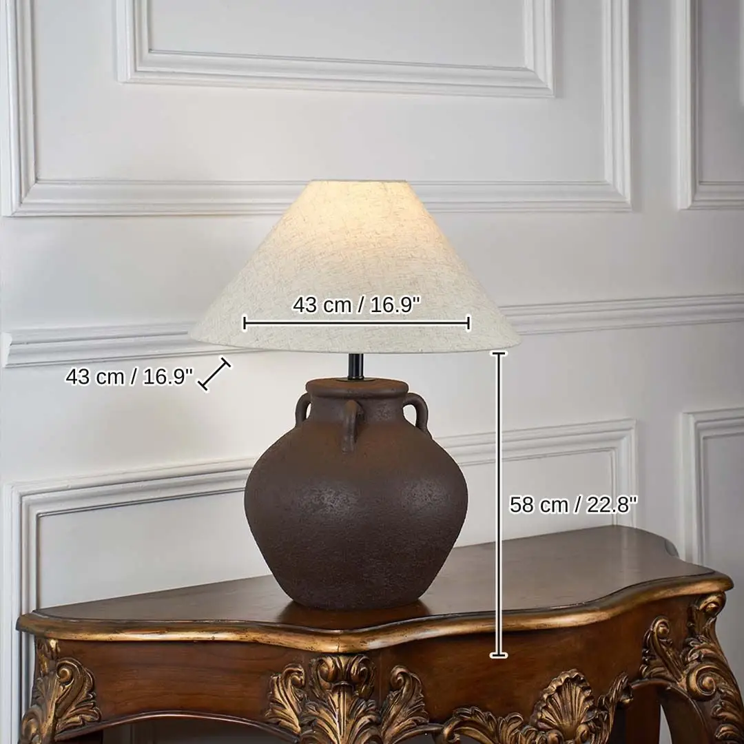 Brown ceramic table lamp with beige linen shade glowing, 58 x 43 x 43 cm (22.8 x 16.9 x 16.9 inches) dimensions