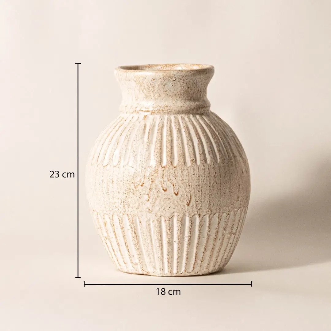 Ribbed vase measuring 23 cm in height and 18 cm in width - ideal for styling with fresh or dried flowers.