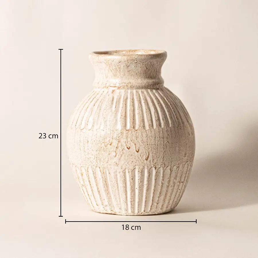 Ribbed vase measuring 23 cm in height and 18 cm in width - ideal for styling with fresh or dried flowers.