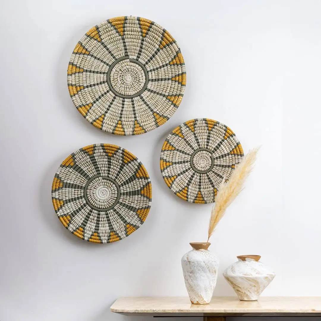 Handcrafted natural seagrass wall basket set with white grey and mustard pattern for boho living room wall décor.