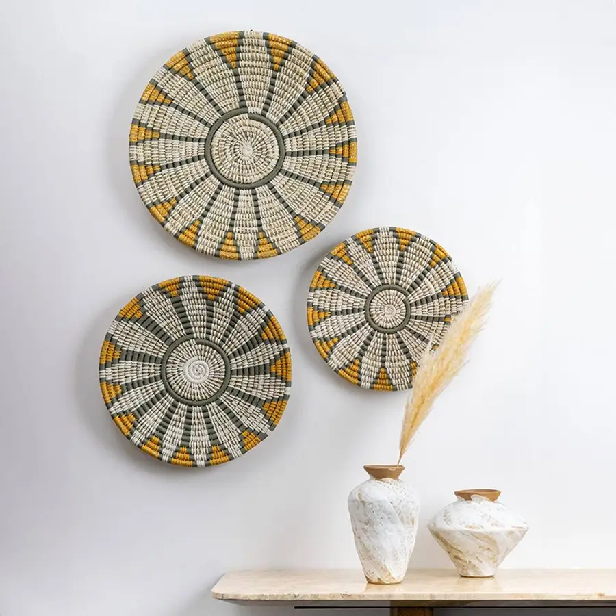 Handcrafted natural seagrass wall basket set with white grey and mustard pattern for boho living room wall décor.