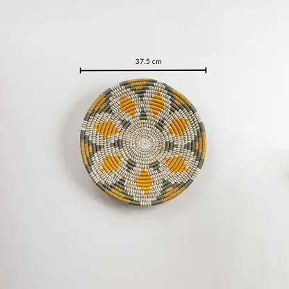 Dimension image of handcrafted natural seagrass wall basket with white and mustard pattern for boho wall décor.