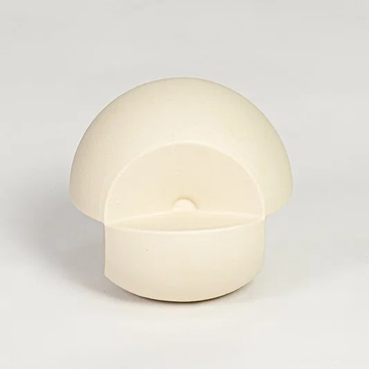 Minimal cream ceramic round decor accent with hollow front detail suitable for shelf styling tabletop display and modern interiors.