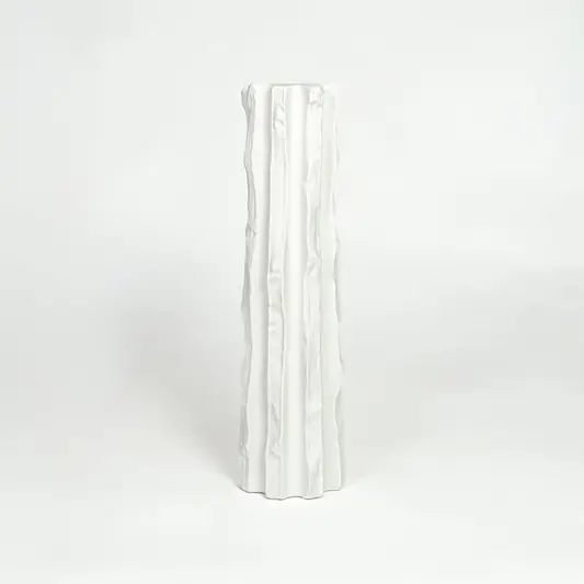 Modern white ceramic statement floor vase with minimalist textured finish for luxury home interiors.