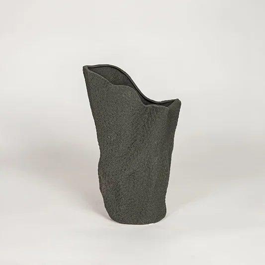 Modern black ceramic decorative floor vase with sculpted organic design ideal for living room corner and stylish home decor.
