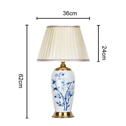Designer ceramic and metal table lamp measuring 62 cm in height and 36 cm in width with a 24 cm shade perfect for adding timeless charm to interiors.
