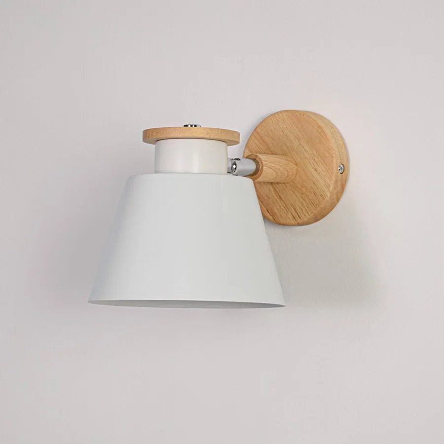 White background closeup of Scandinavian wall light showing matte white shade natural wooden mount and compact design ideal for modern minimal interiors.